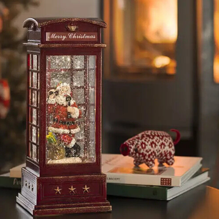 Vintage Christmas Light Up Water Lantern in red, with a christmas living room backdrop