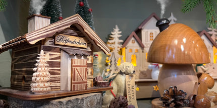 Traditional wooden, hand carved German incense burners, a mushroom and Ski Chalet. 