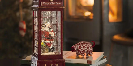 Vintage Christmas Light Up Water Lantern in red, with a christmas living room backdrop