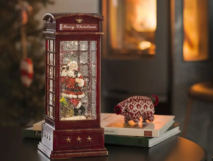 Vintage Christmas Light Up Water Lantern in red, with a christmas living room backdrop