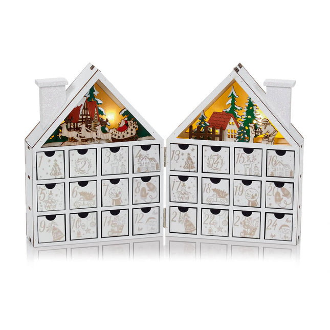 lit white wooden advent book house image 0